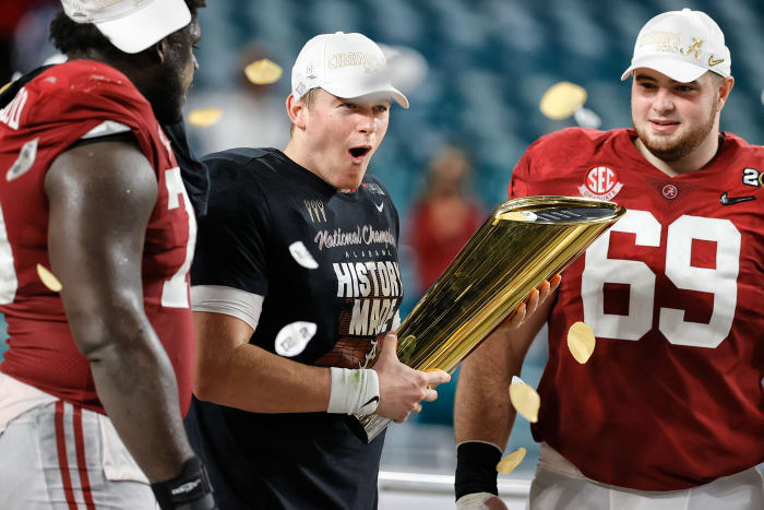 Alabama QB Mac Jones celebrates with the national championship trophy